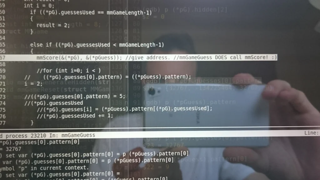 Screenshot of Mastermind game debugger showing code assigning guess pattern to game state on a phone screen held in hand.
