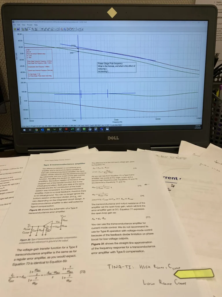 Dell laptop displaying power stage frequency response graphs with transconductance amplifier design papers and sticky notes in front.